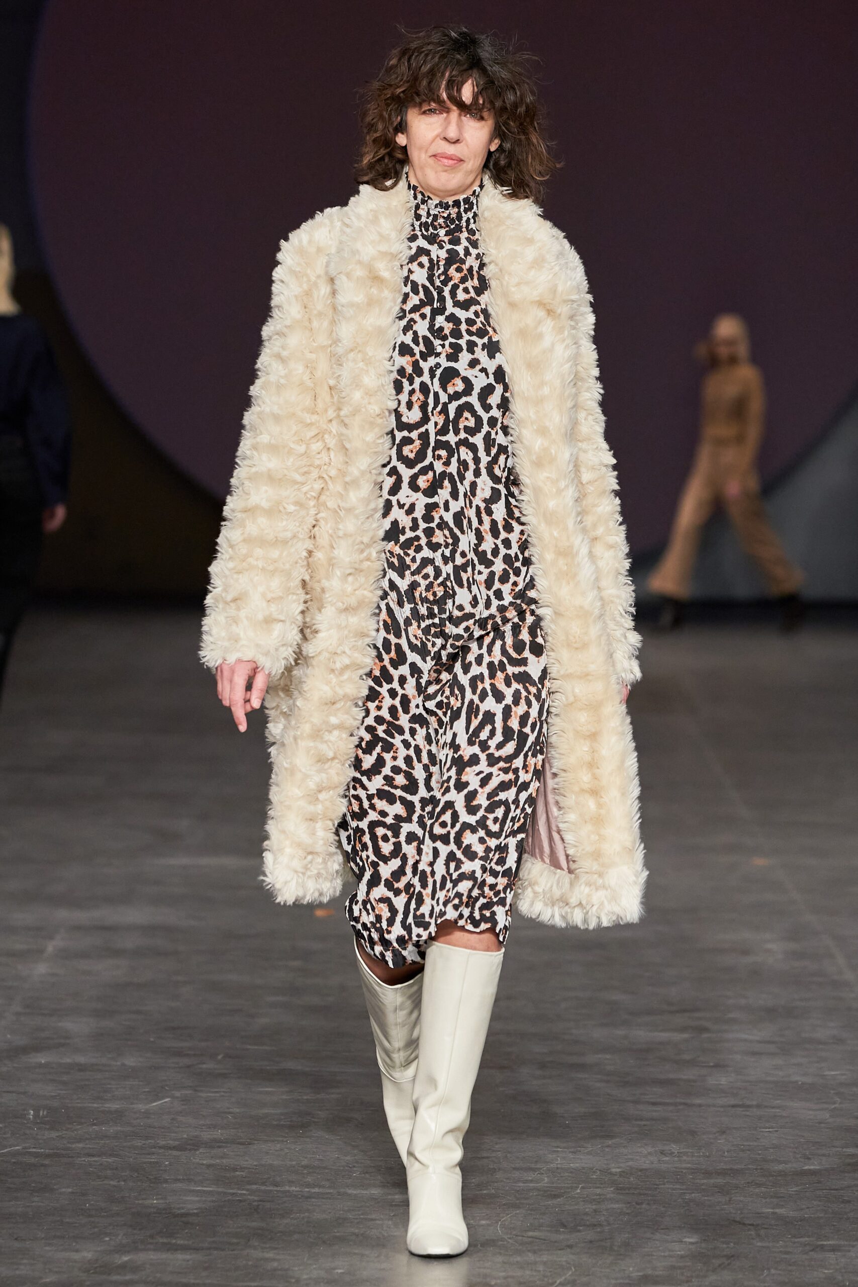 beige faux-fur coat with animal-print dress