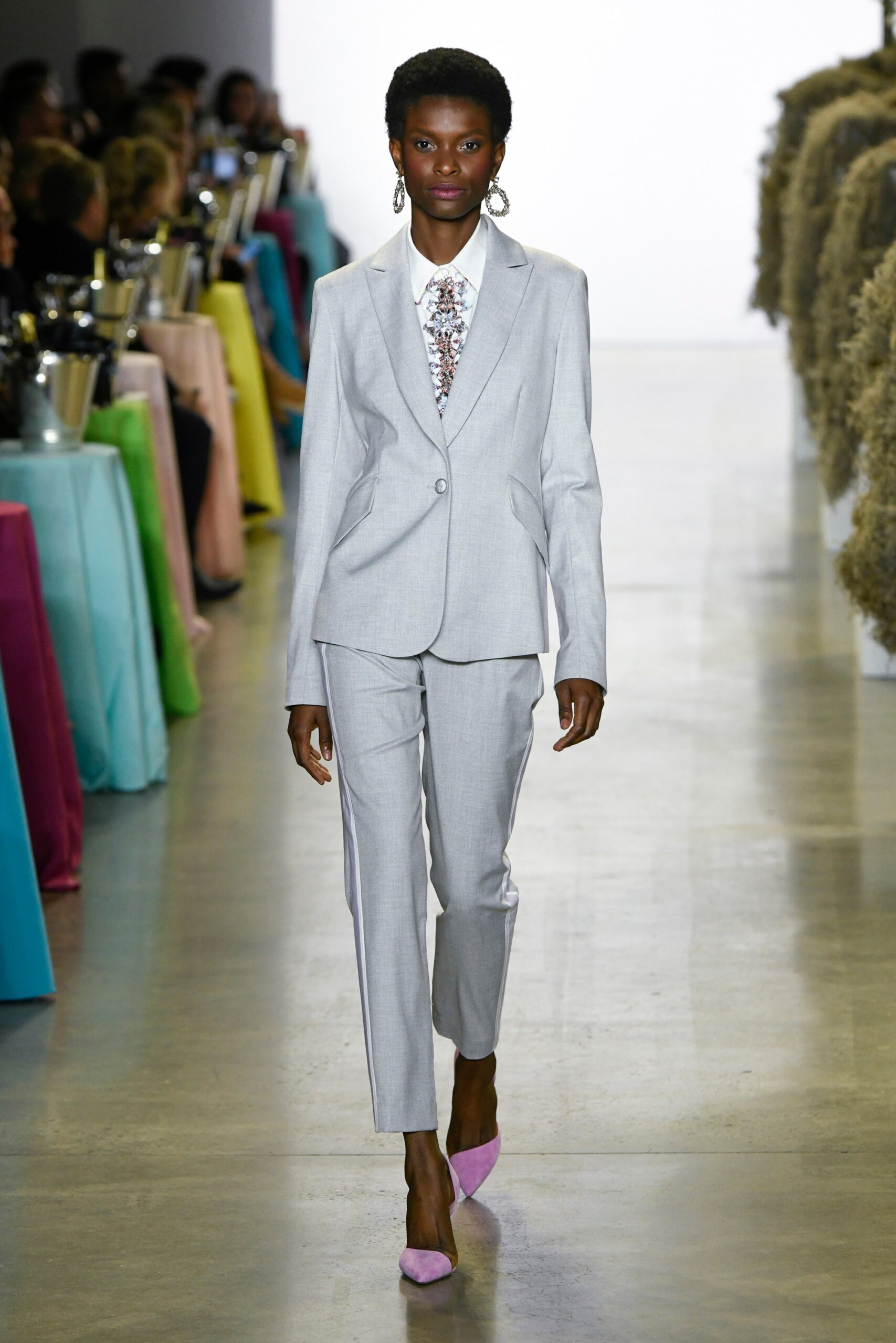 gray tailored suit with pink shoes