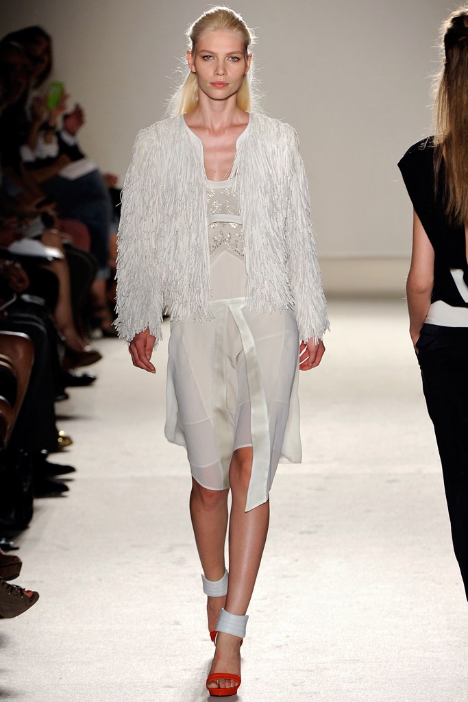 white fringed jacket and sheer dress