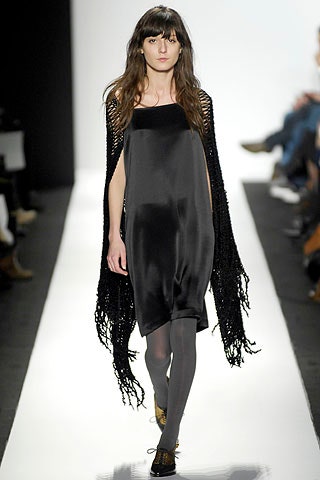 black silk mini dress with fringed cape