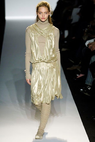 beige silk sleeveless high-neck fitted draped flowing dress