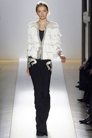 white fringed jacket and black pants