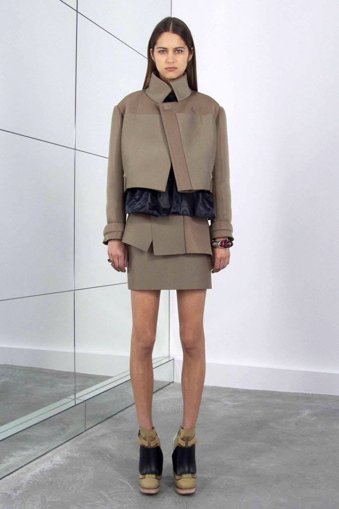 beige structured jacket with black top