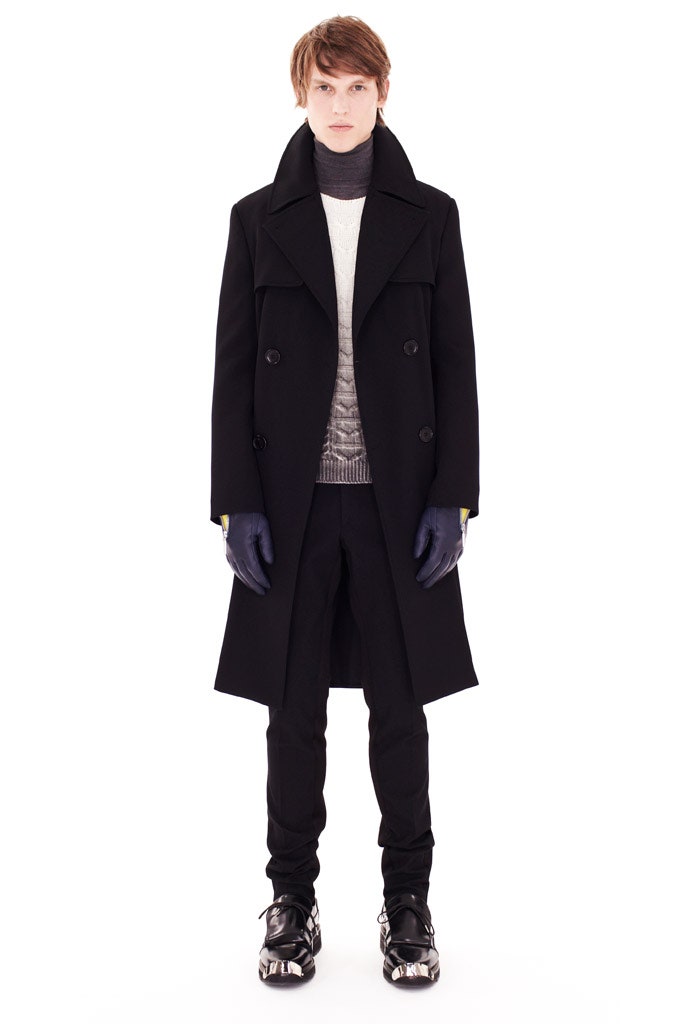 black tailored coat with white sweater