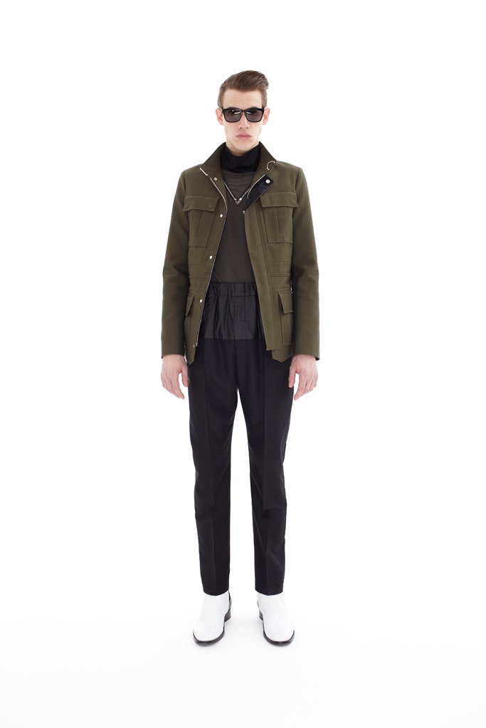 green jacket black top tailored pants