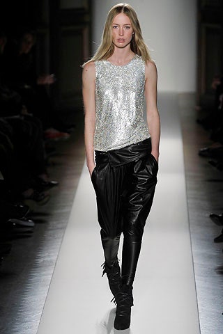 silver sequined sleeveless top with black leather pants