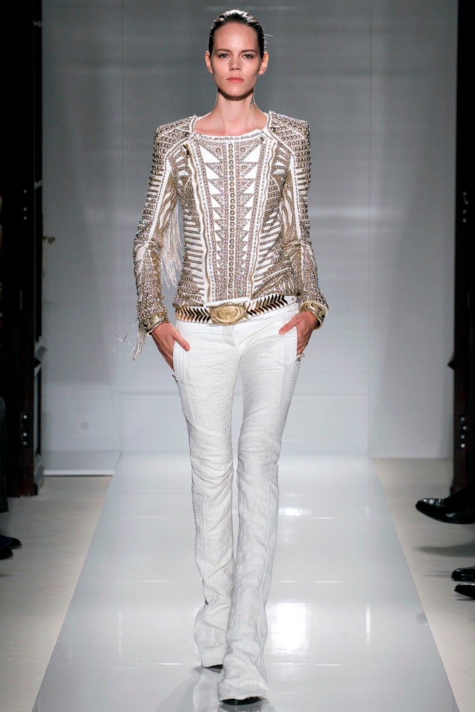 white embroidered top with gold belt