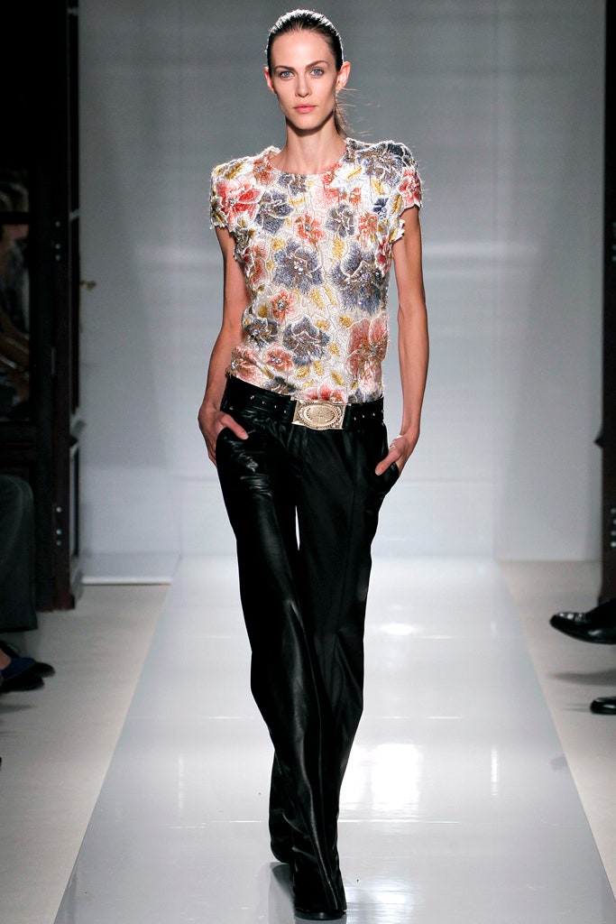 multi-colored embroidered top with black pants