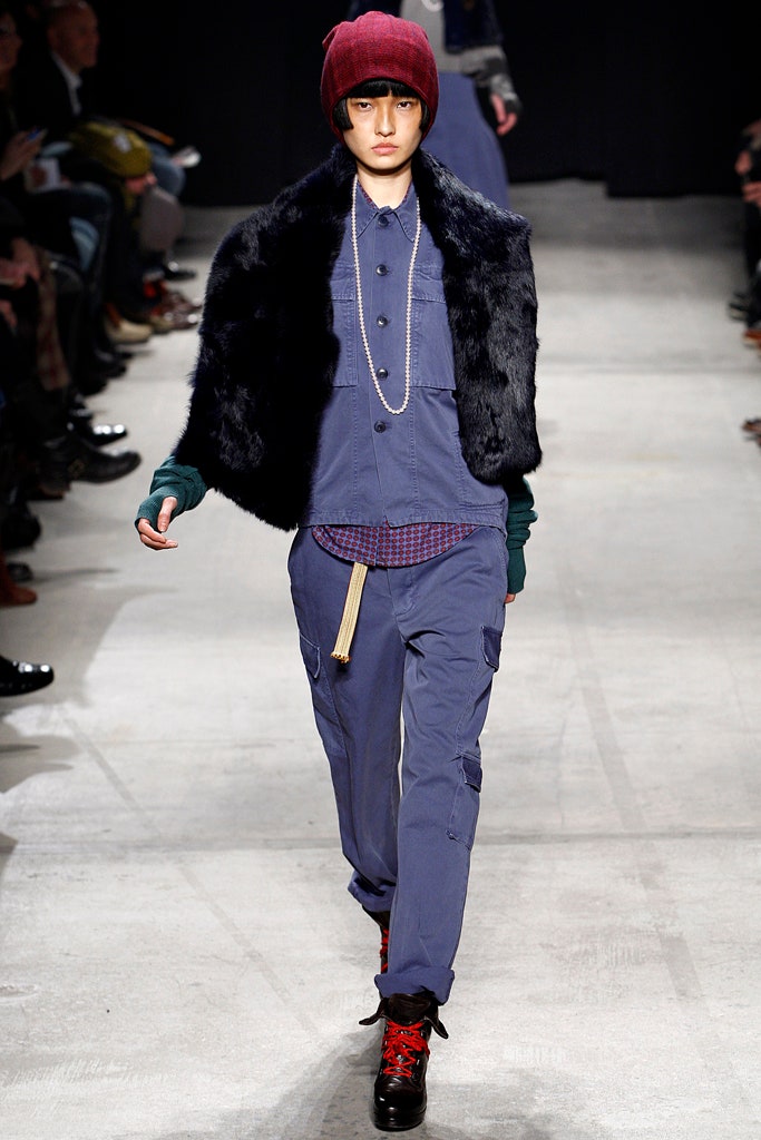 black faux-fur jacket with blue shirt