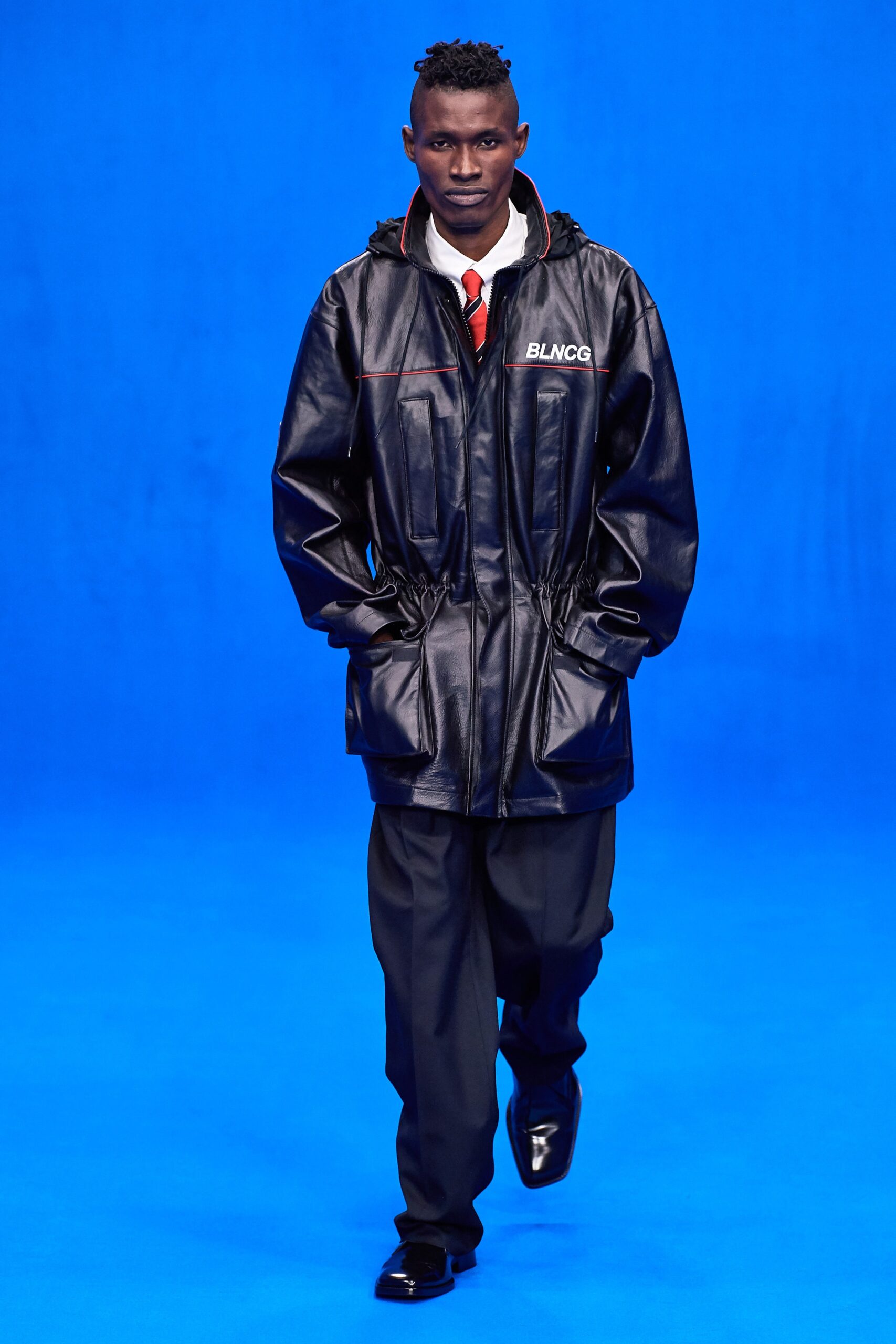 black leather jacket and tailored pants