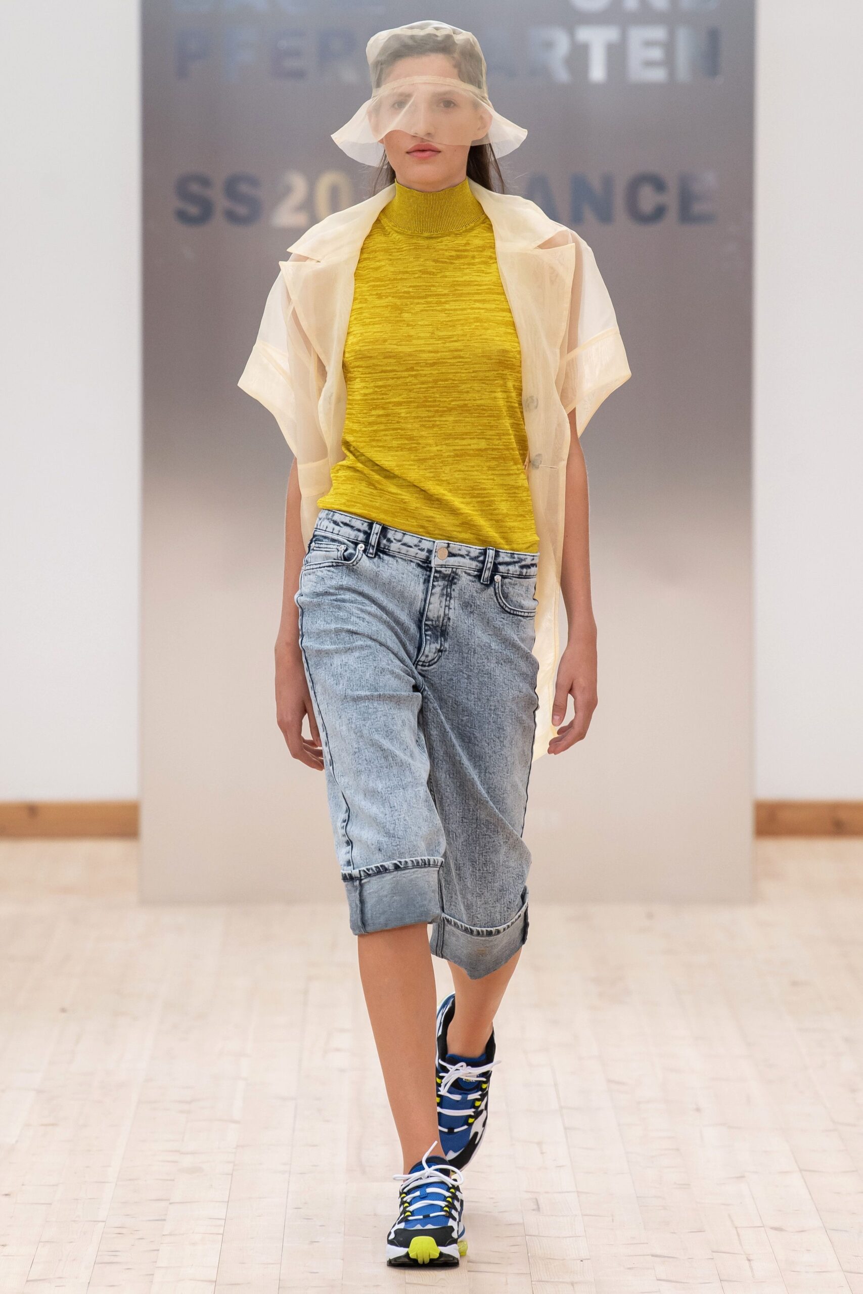 yellow fitted top with denim shorts