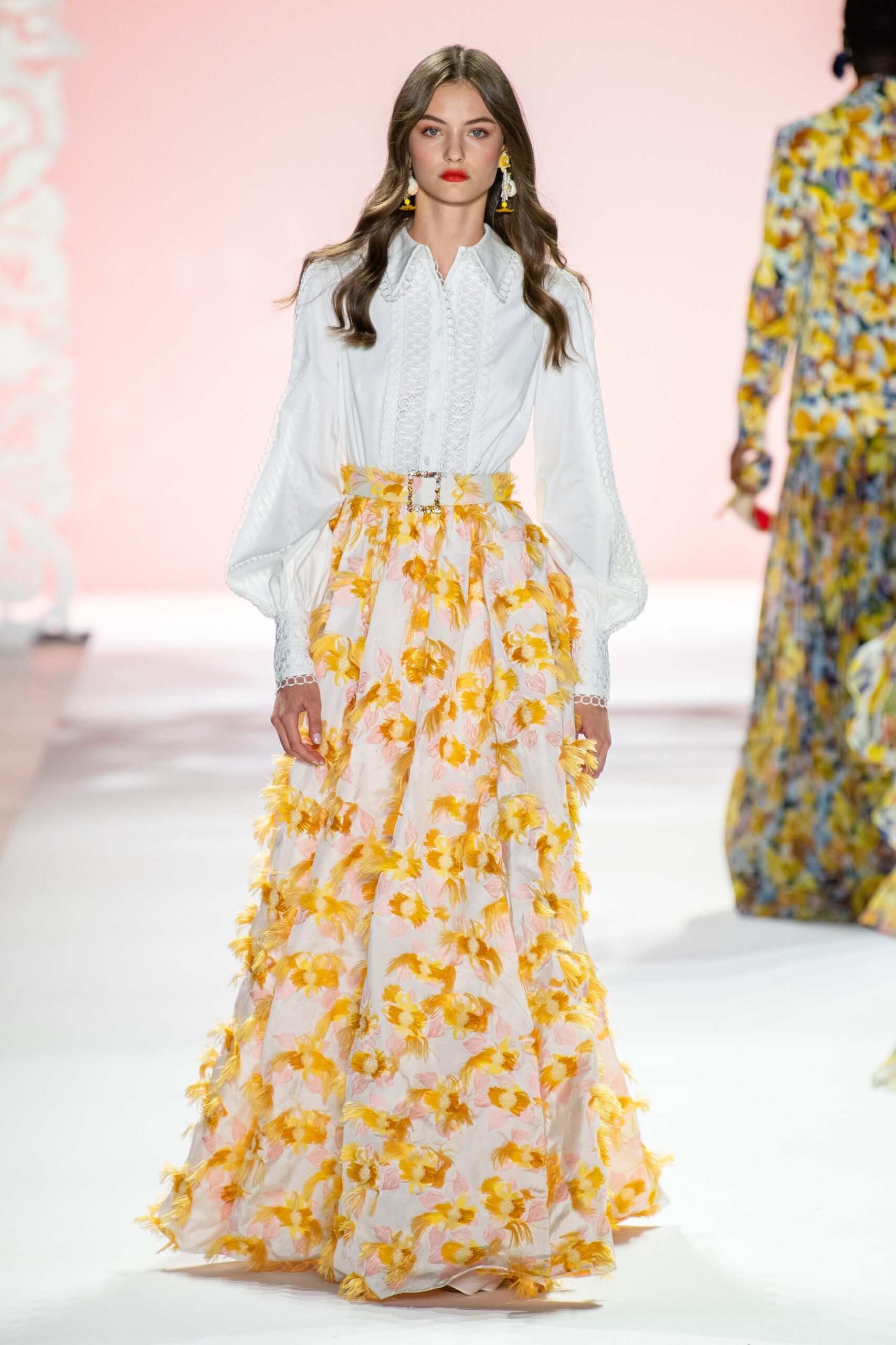 white ruffled blouse and yellow tiered skirt