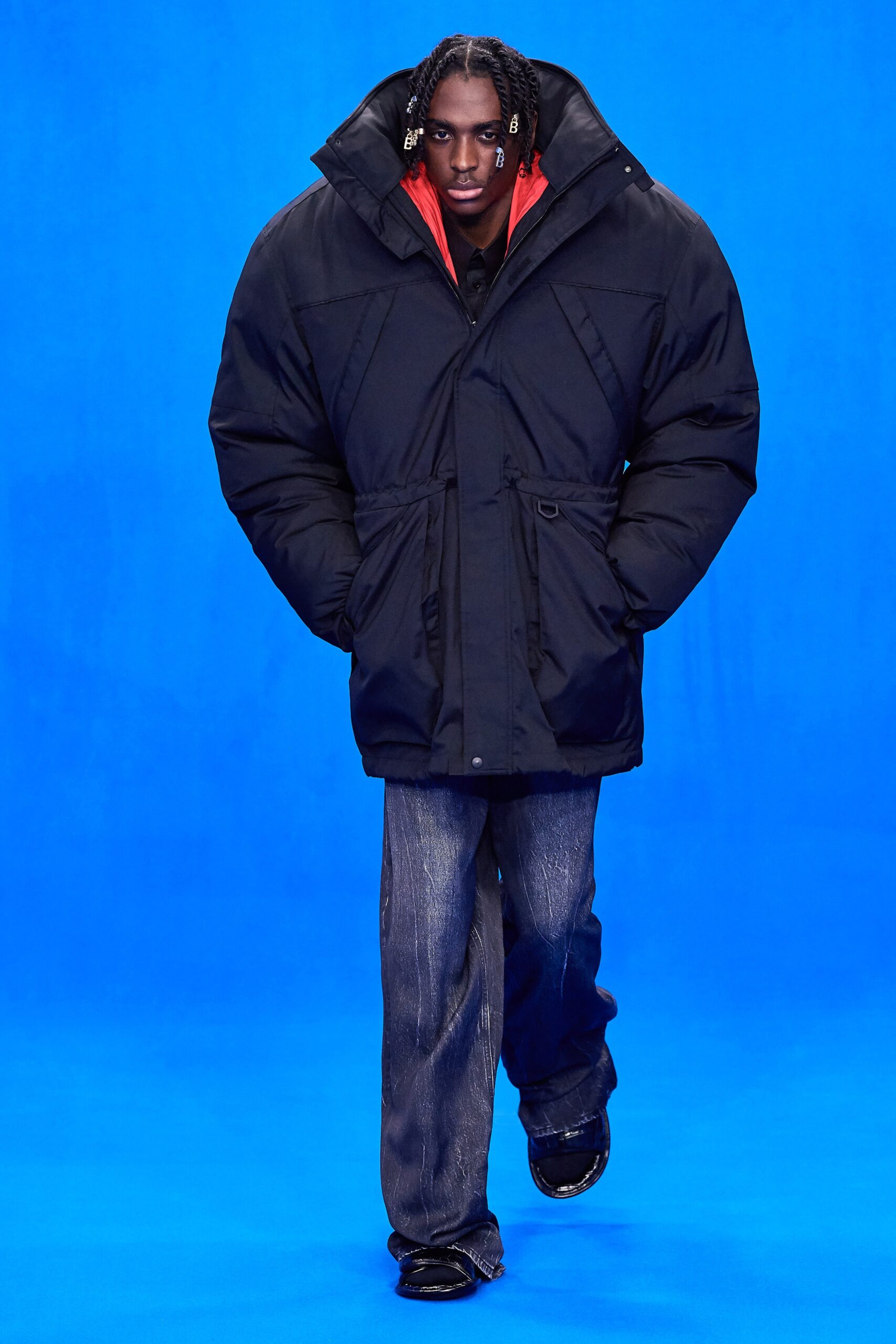 oversized black parka with relaxed jeans