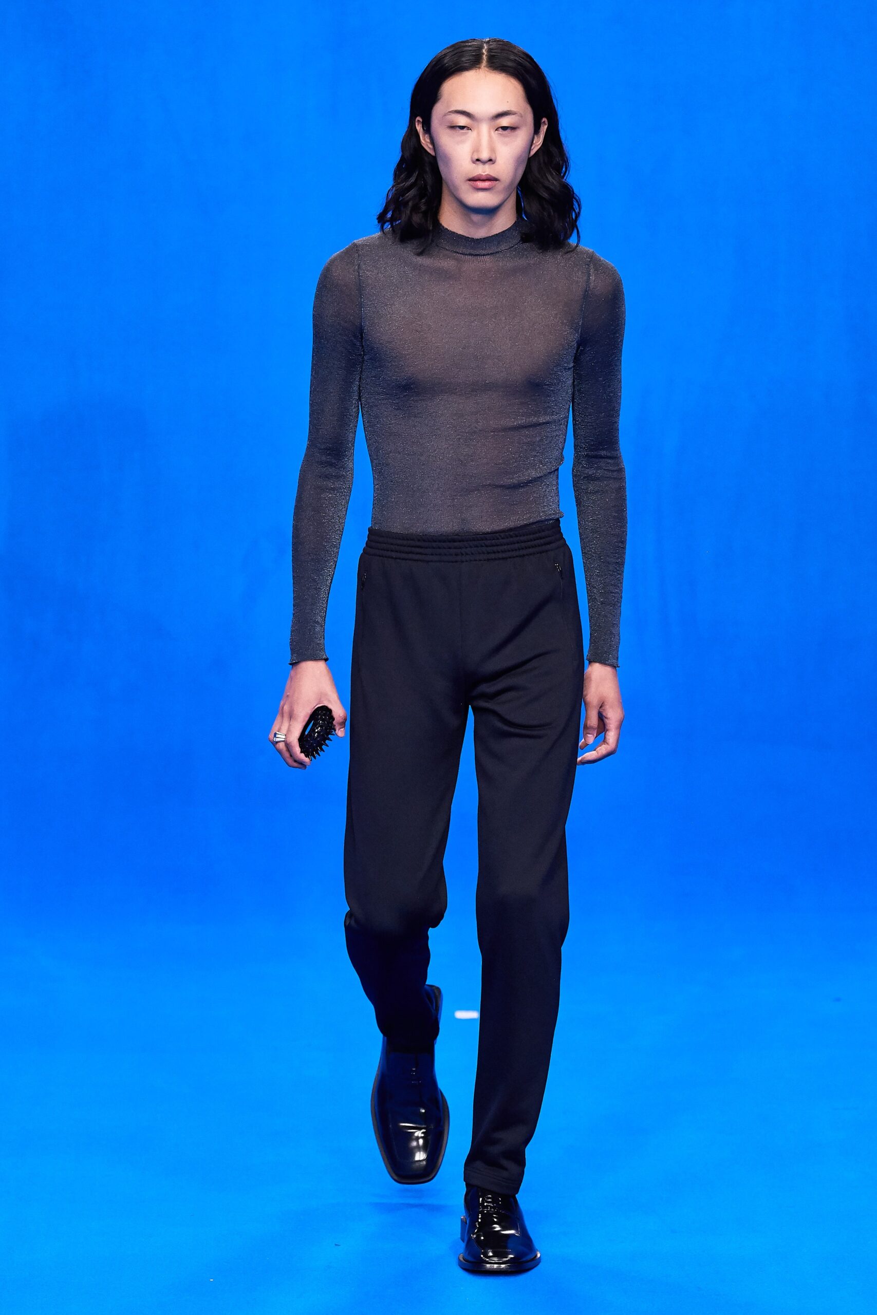 black fitted mesh top and relaxed pants