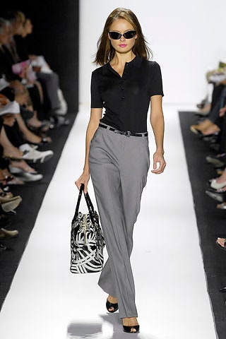 black fitted top with gray tailored pants