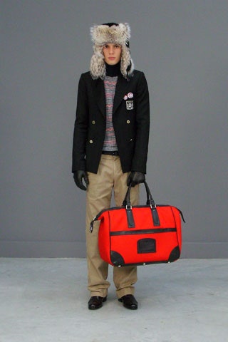 black tailored blazer with red sweater