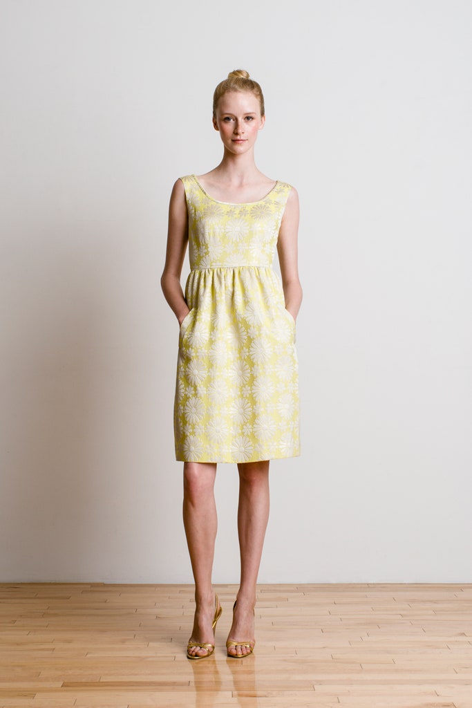 yellow cotton sleeveless scoop-neck fitted pleated pockets dress