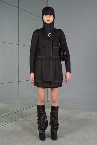 black fitted coat and mini skirt