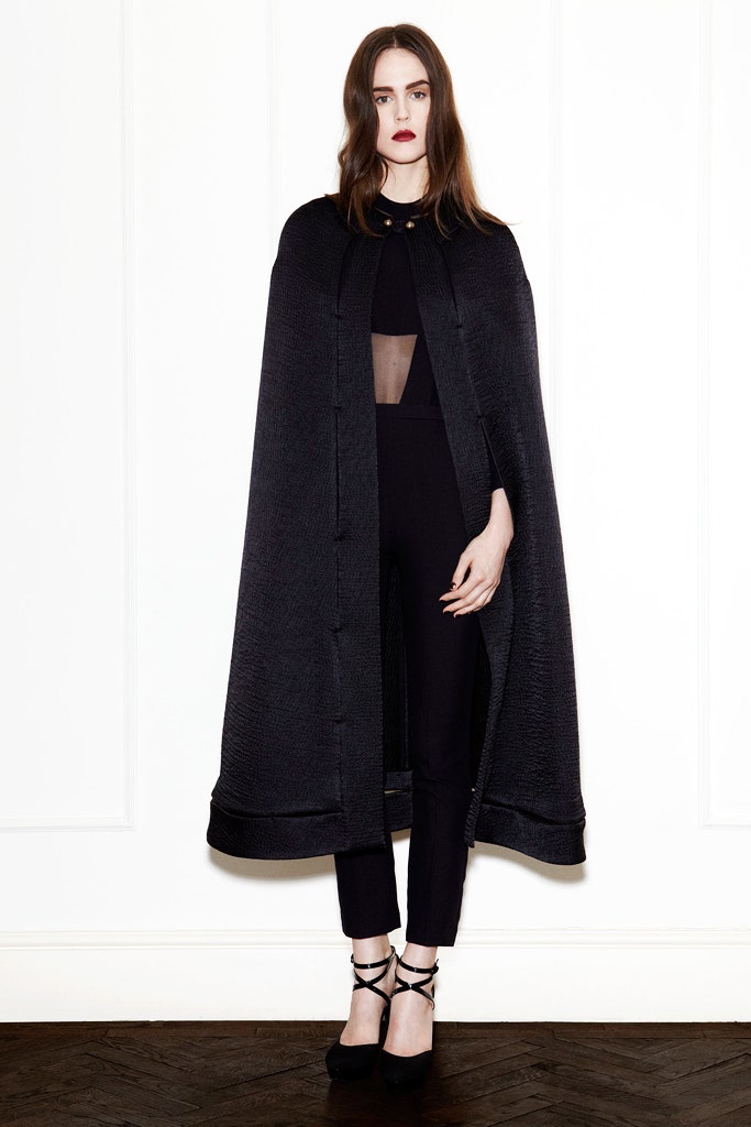 black cape and jumpsuit ensemble