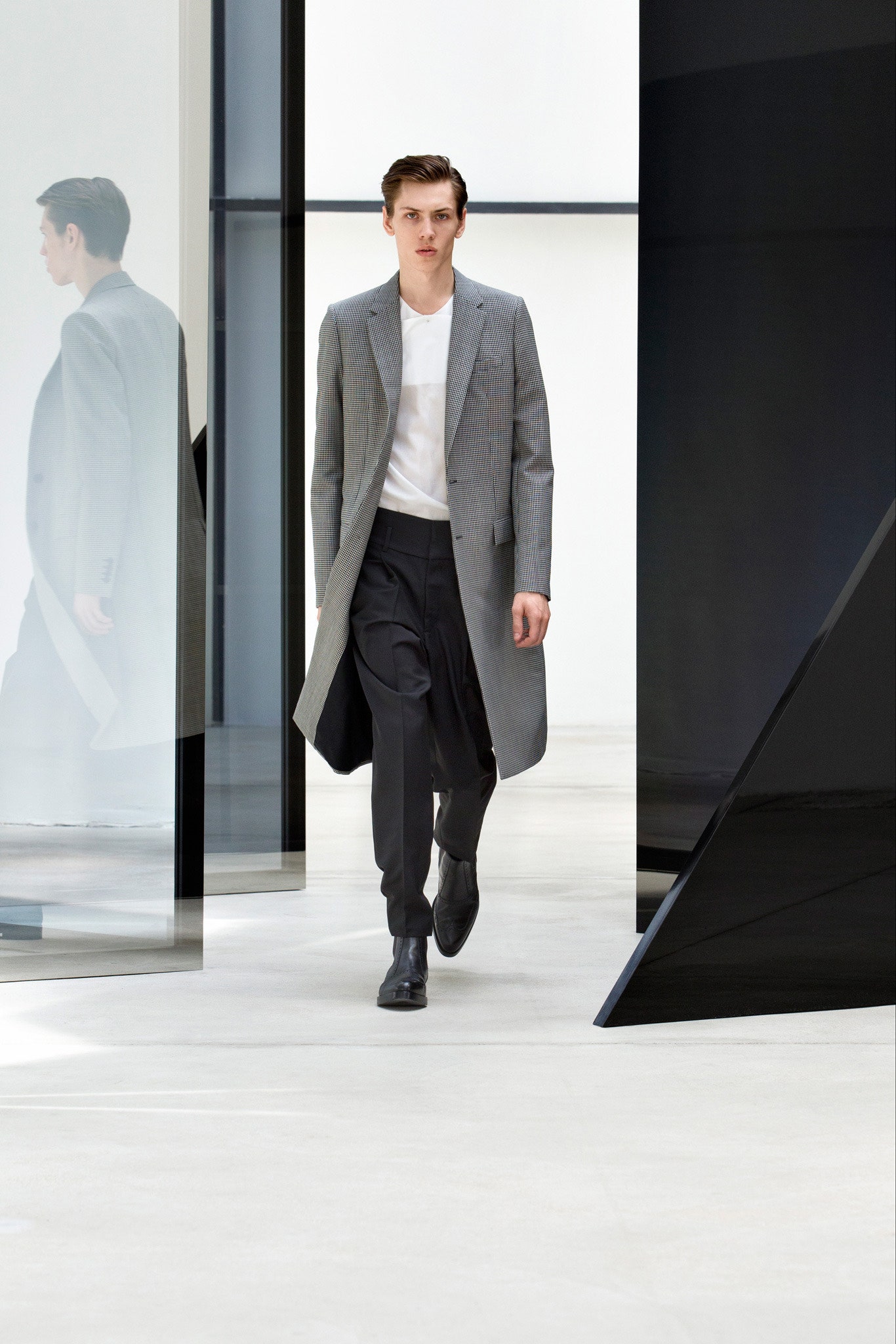 gray tailored coat with black pants