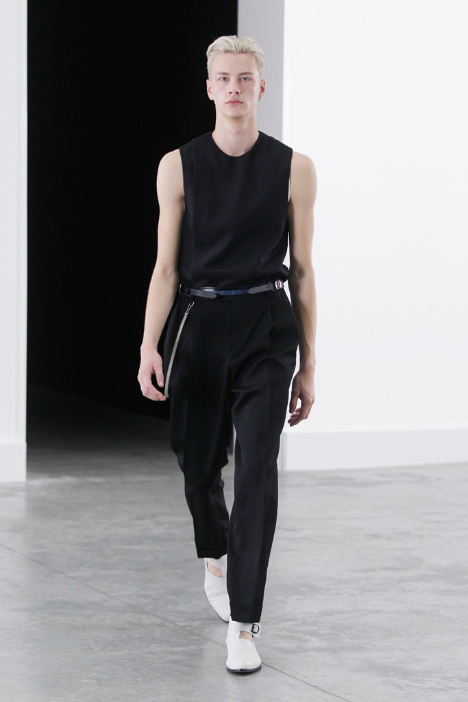 black fitted sleeveless top with tailored pants