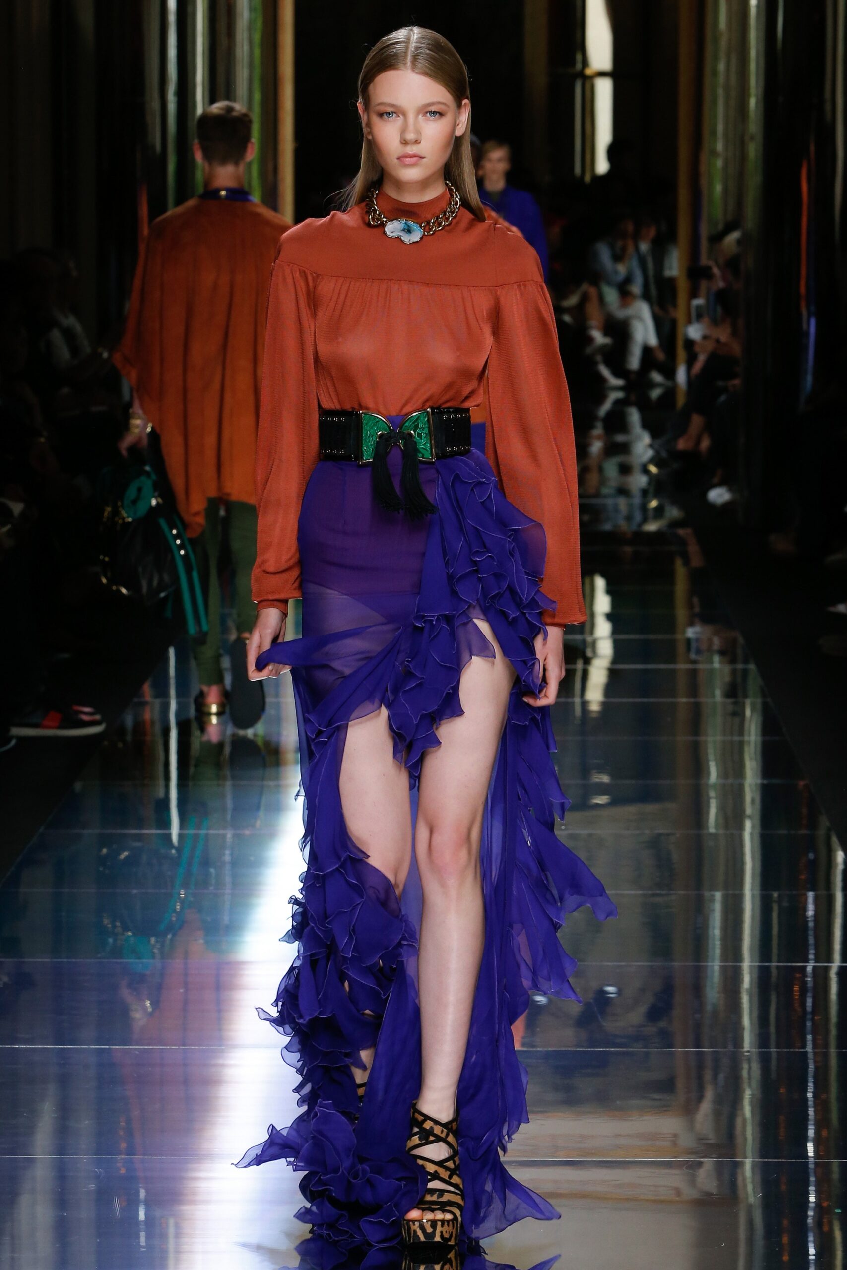 orange silk blouse with purple skirt