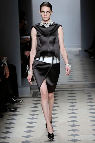 black silk sleeveless high-neck fitted structured top