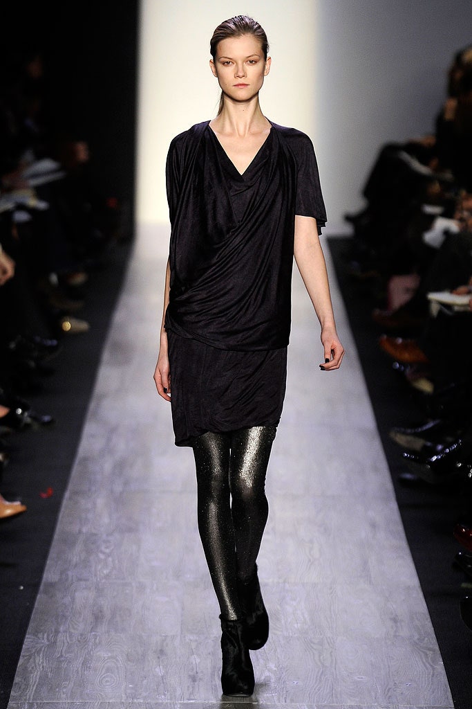 black draped mini dress with shiny leggings