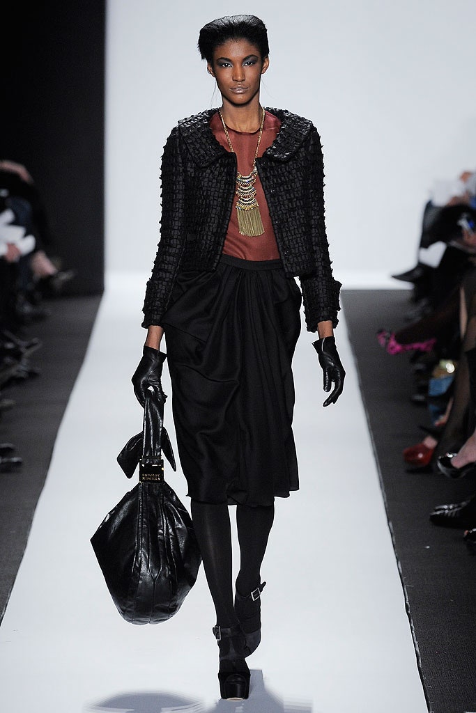 black textured jacket with brown top