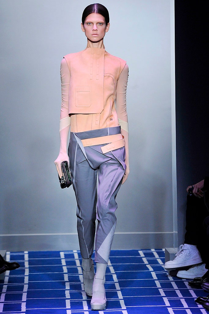 peach fitted top with gray tailored pants