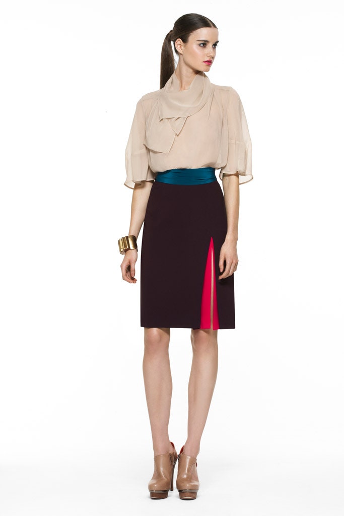 beige silk blouse and purple skirt
