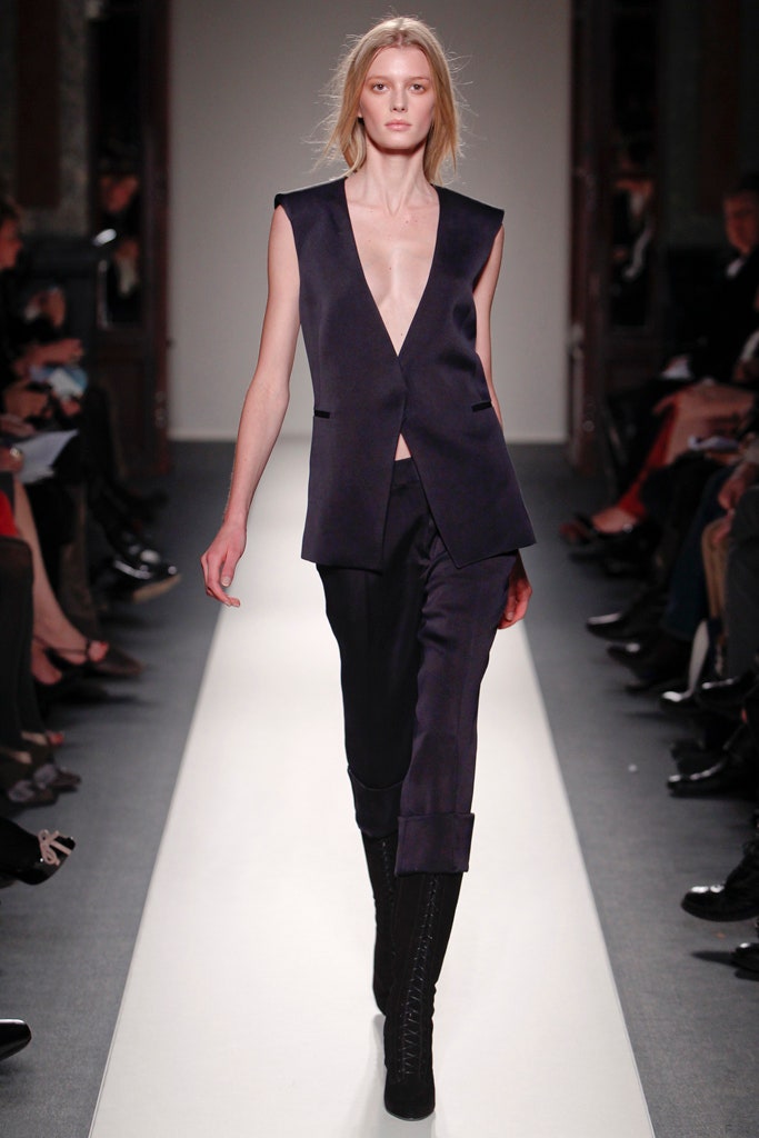 black silk sleeveless blazer and fitted pants