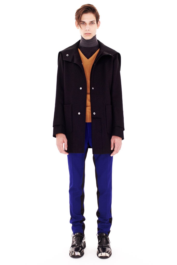 black coat orange sweater blue pants
