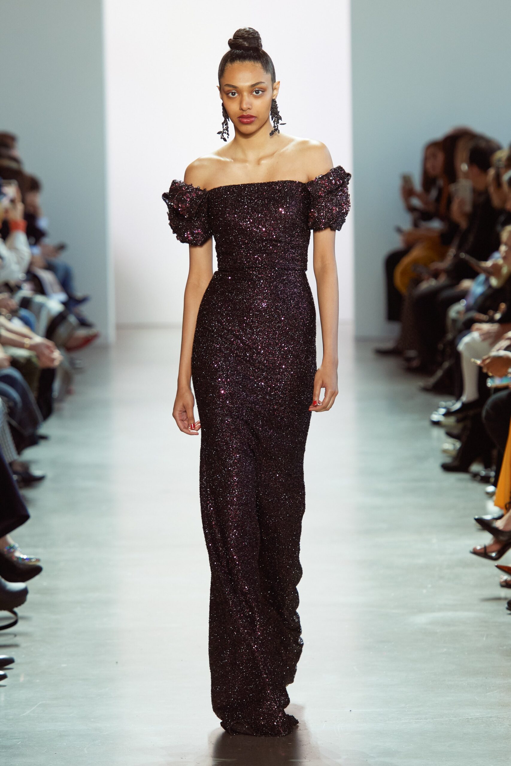 black sequined off-shoulder gown