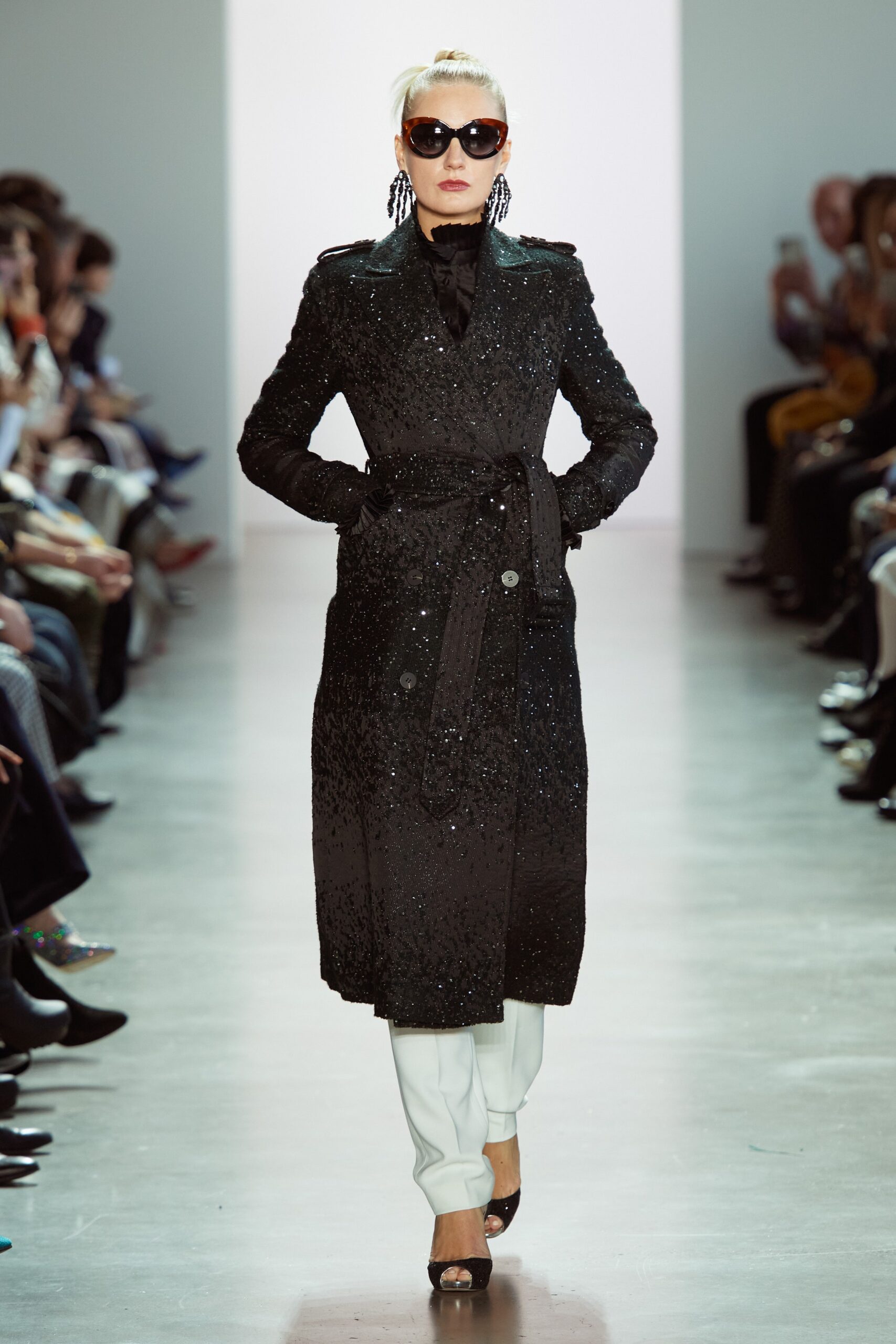 black sequined coat with white pants