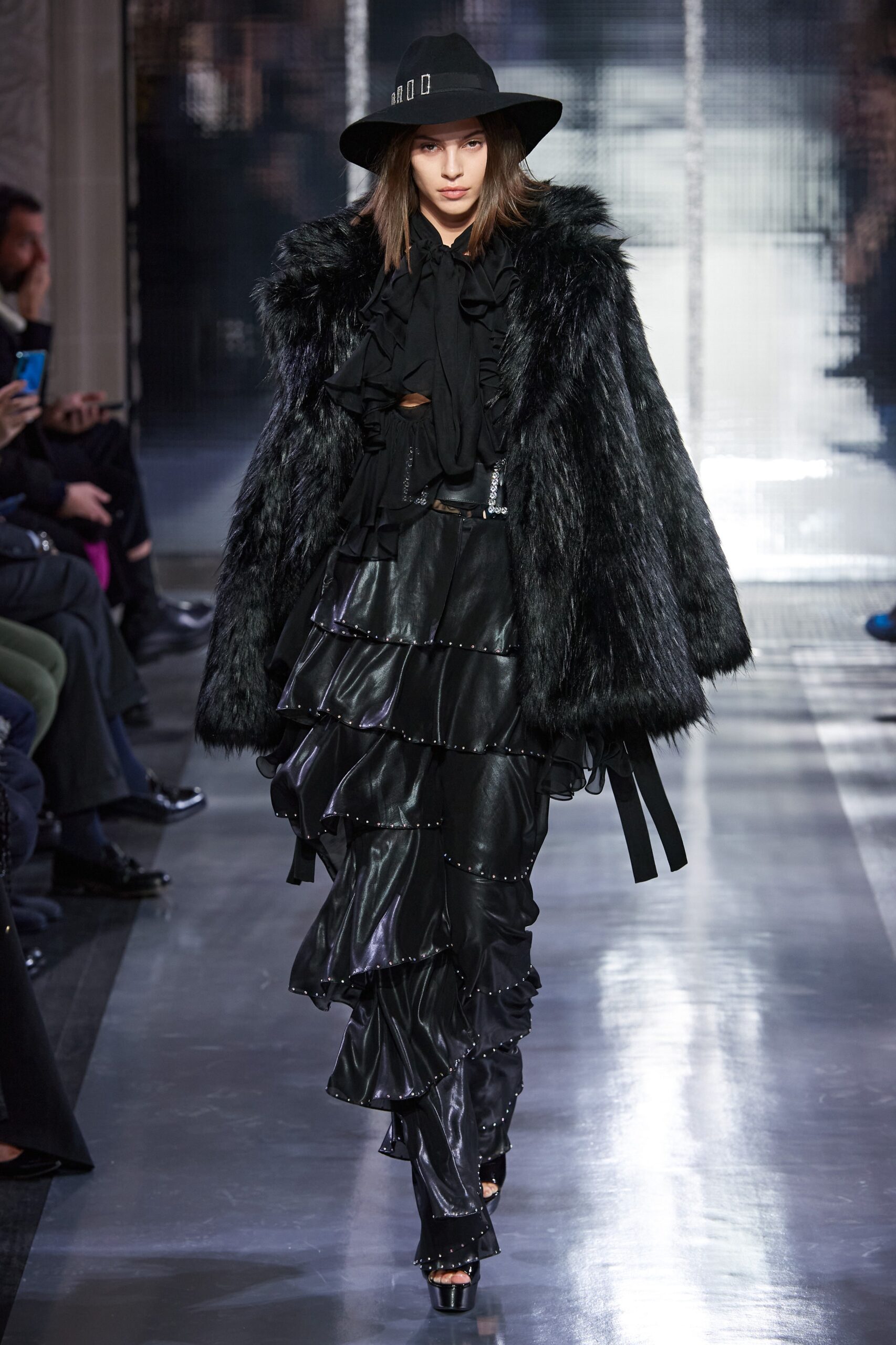 black faux-fur coat and leather dress
