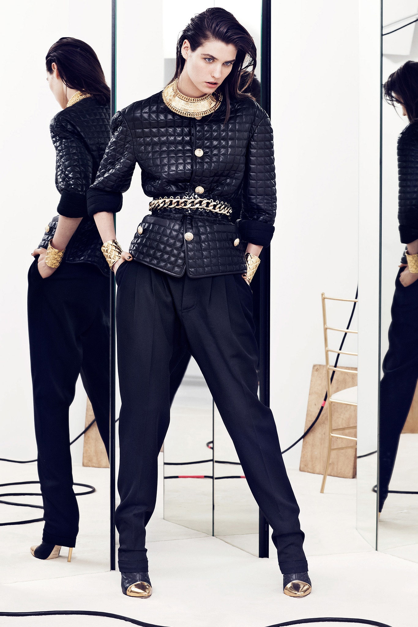 black quilted jacket and tailored pants