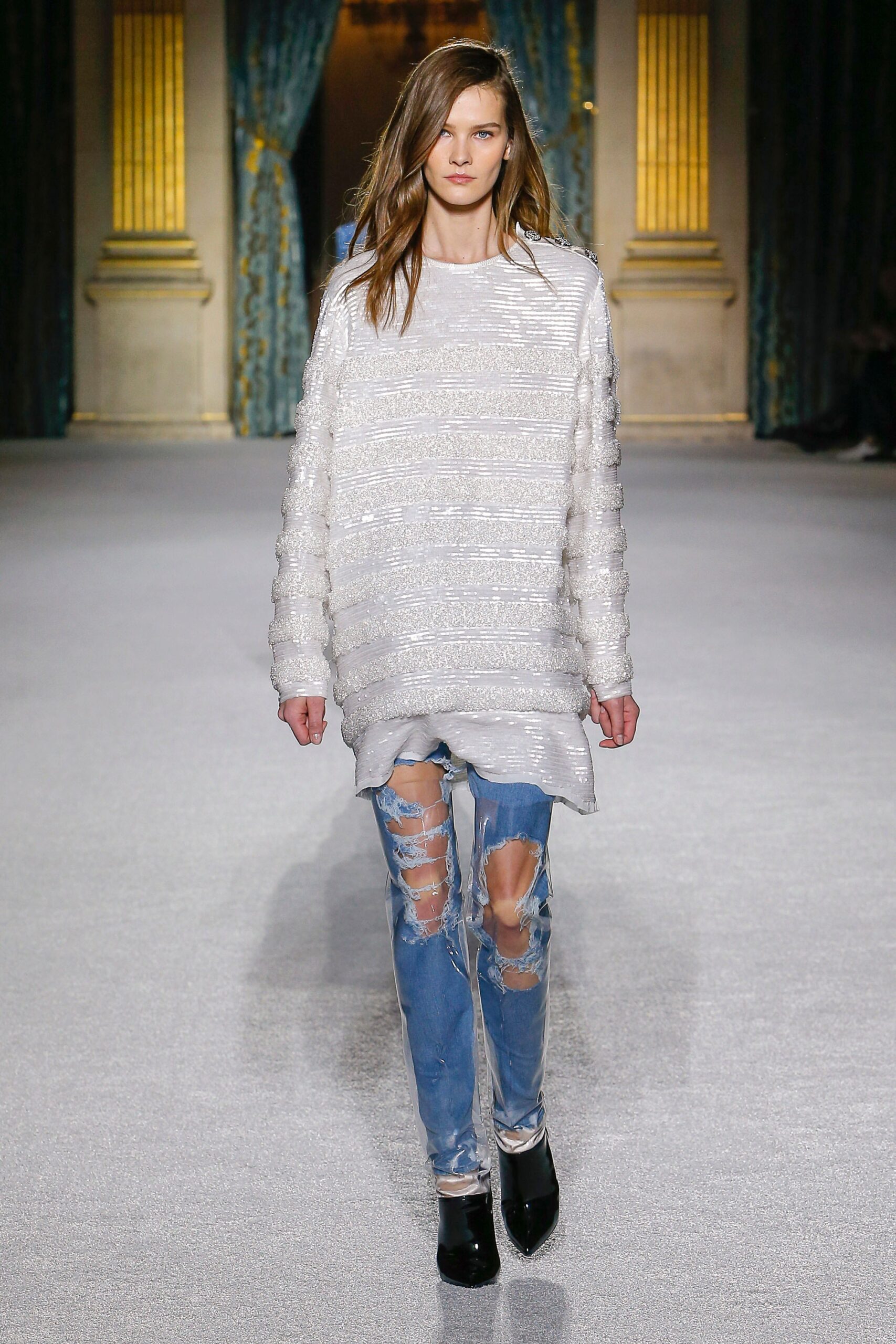 white textured sweater with distressed jeans