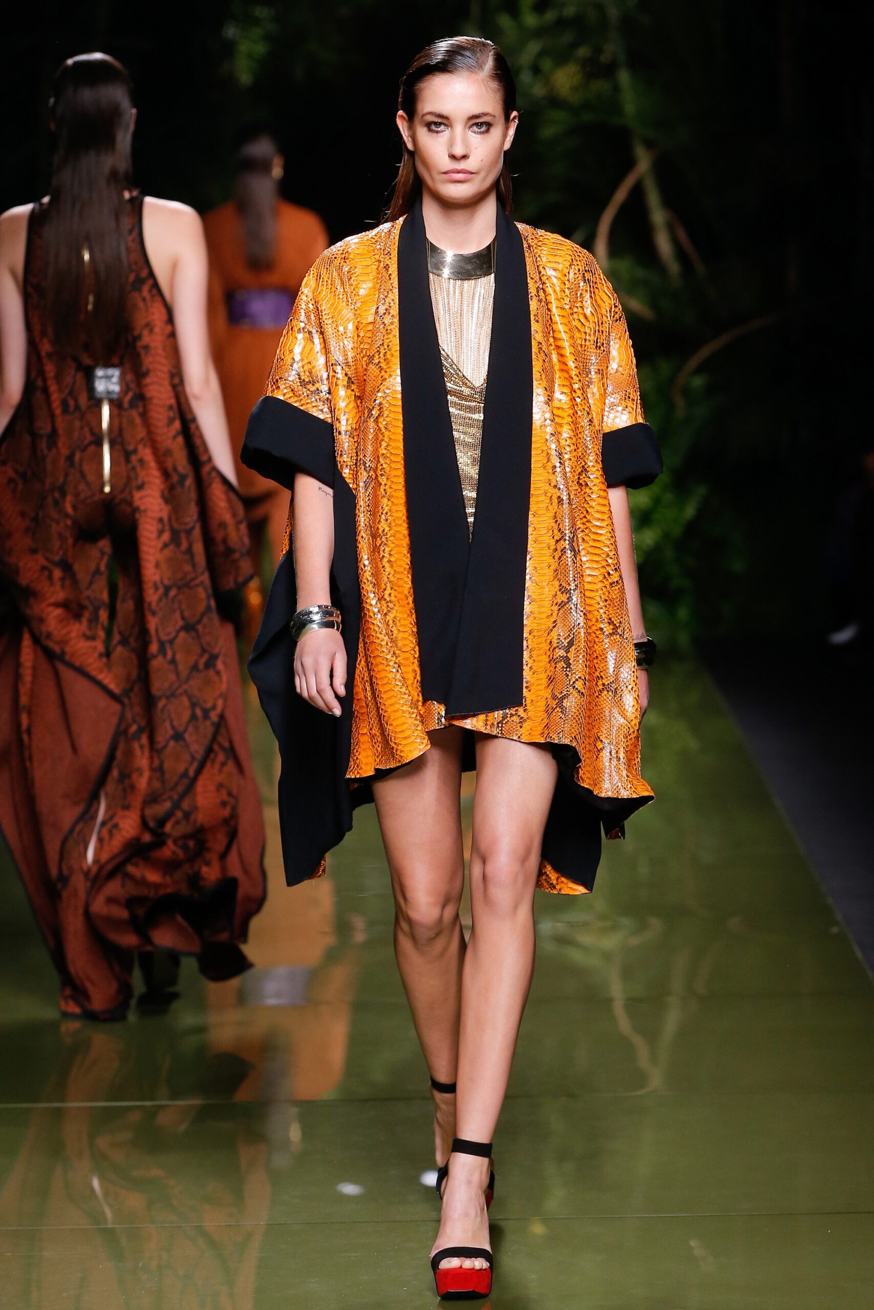 gold mini dress with orange cape