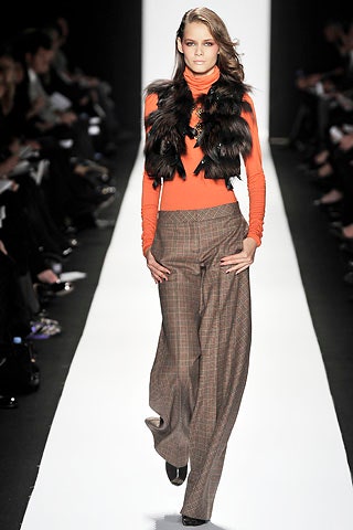 orange fitted top with faux-fur vest