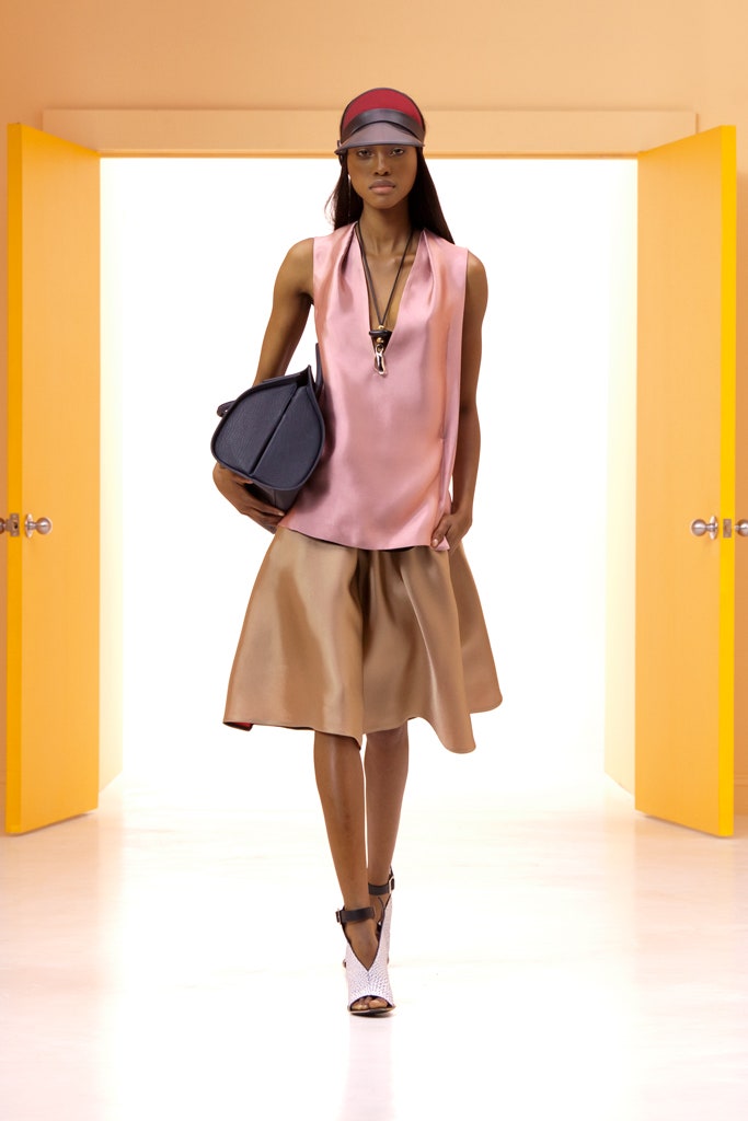 pink silk sleeveless top and beige midi skirt