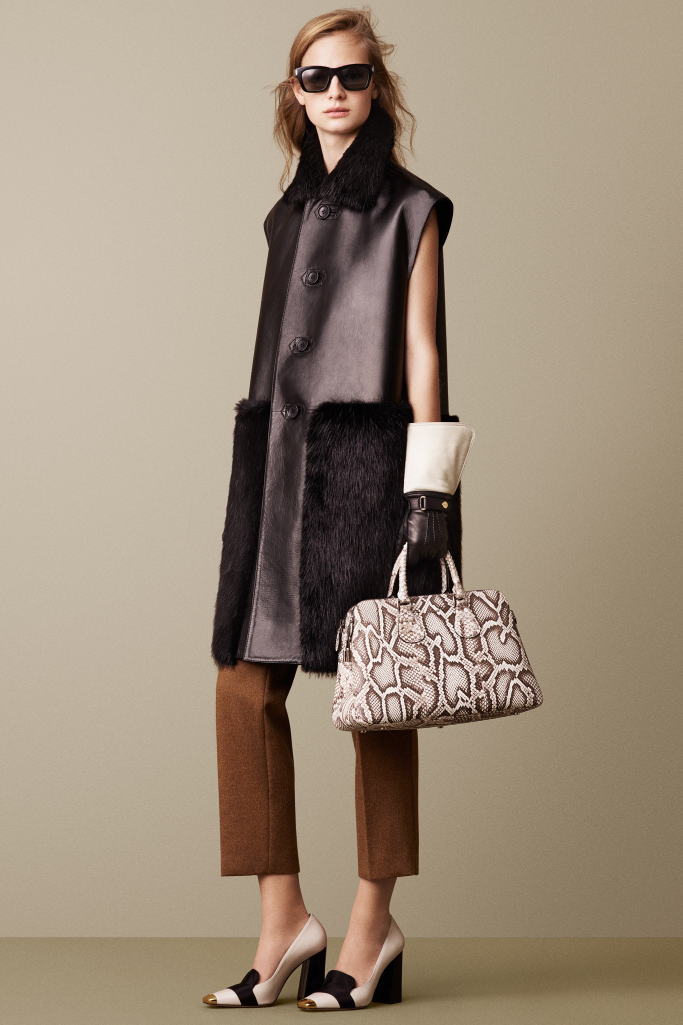 black leather sleeveless collared fitted buttoned coat