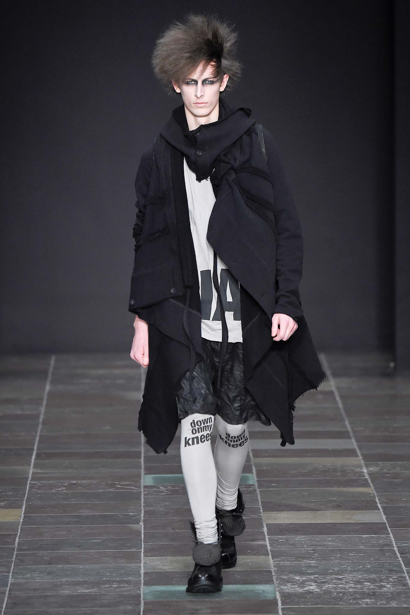 black coat with layered t-shirt