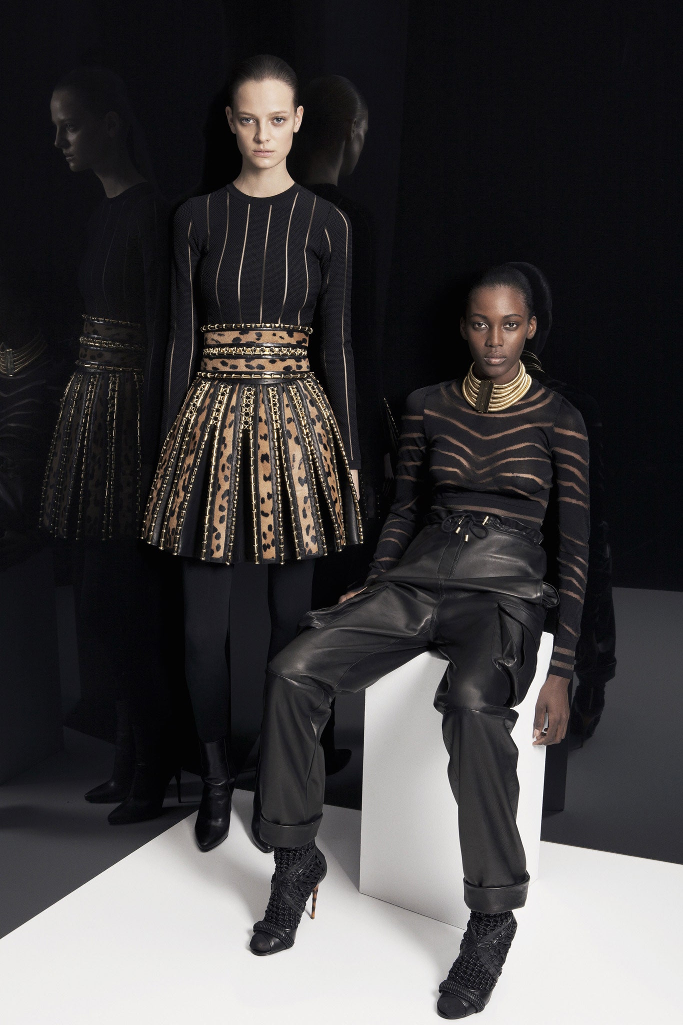 black fitted top and pleated skirt