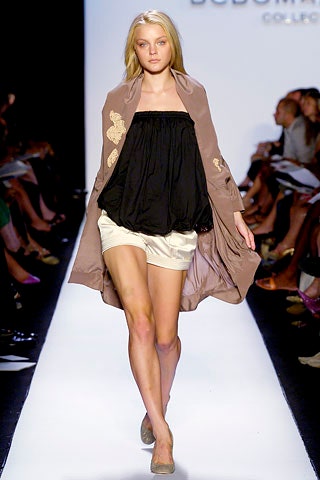 black relaxed top with beige coat
