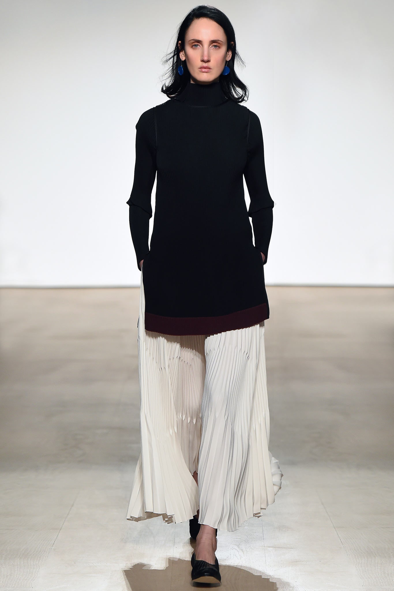 black fitted top with pleated skirt