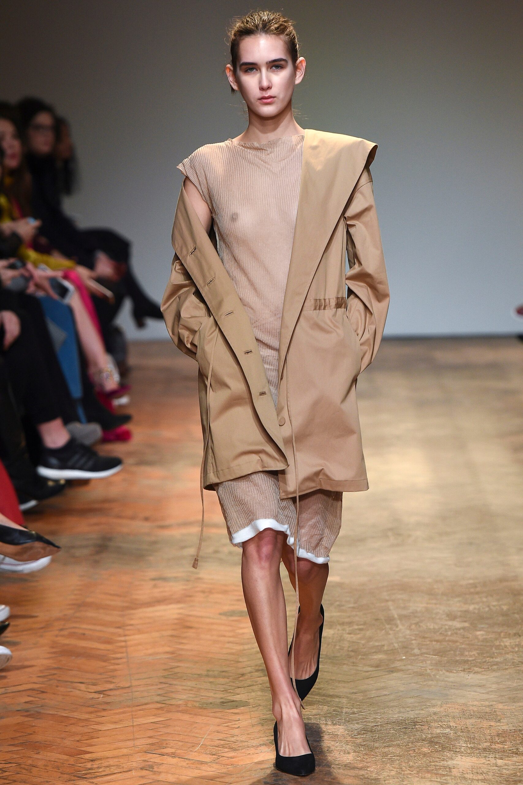 beige relaxed coat and fitted dress
