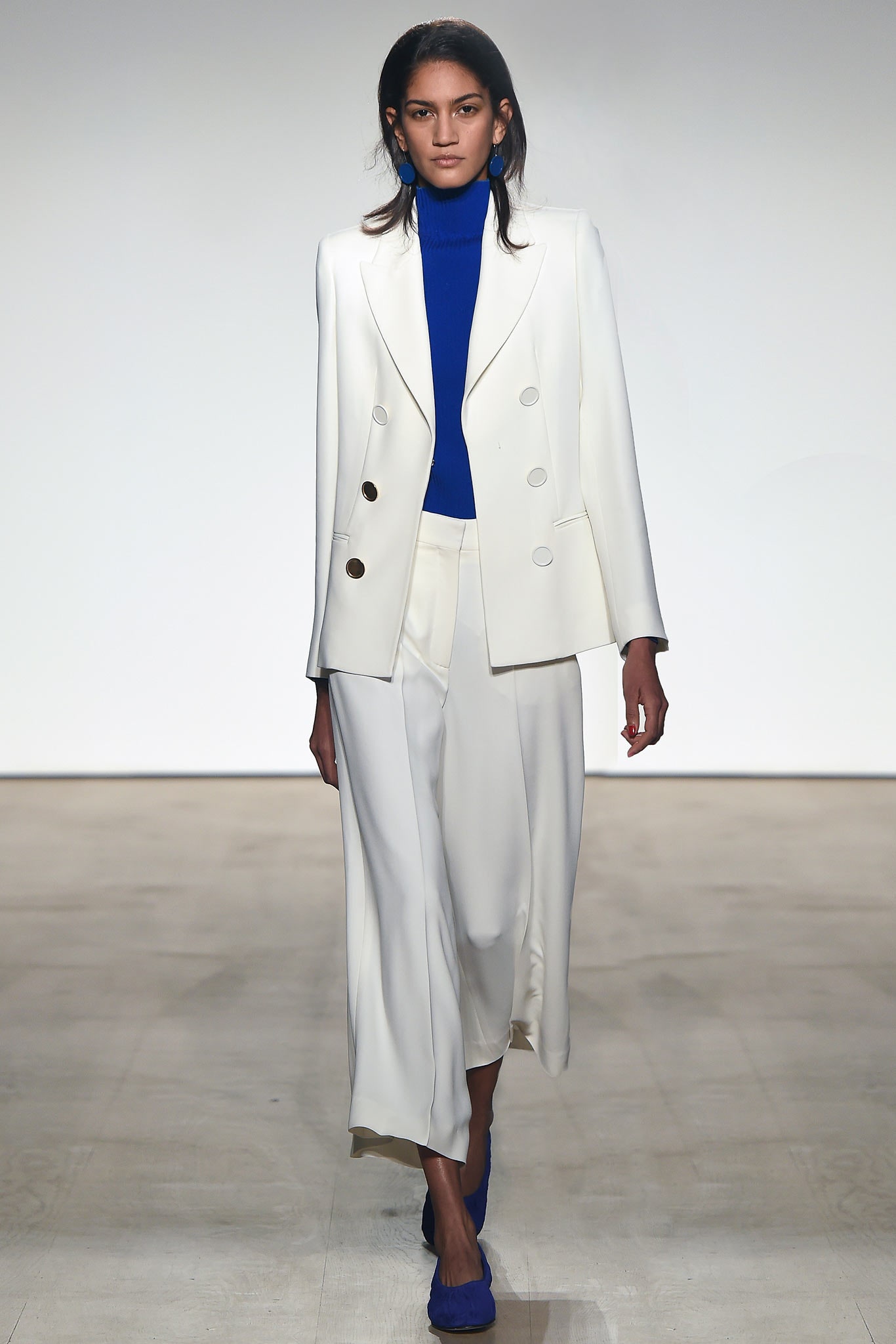 white tailored suit with blue top