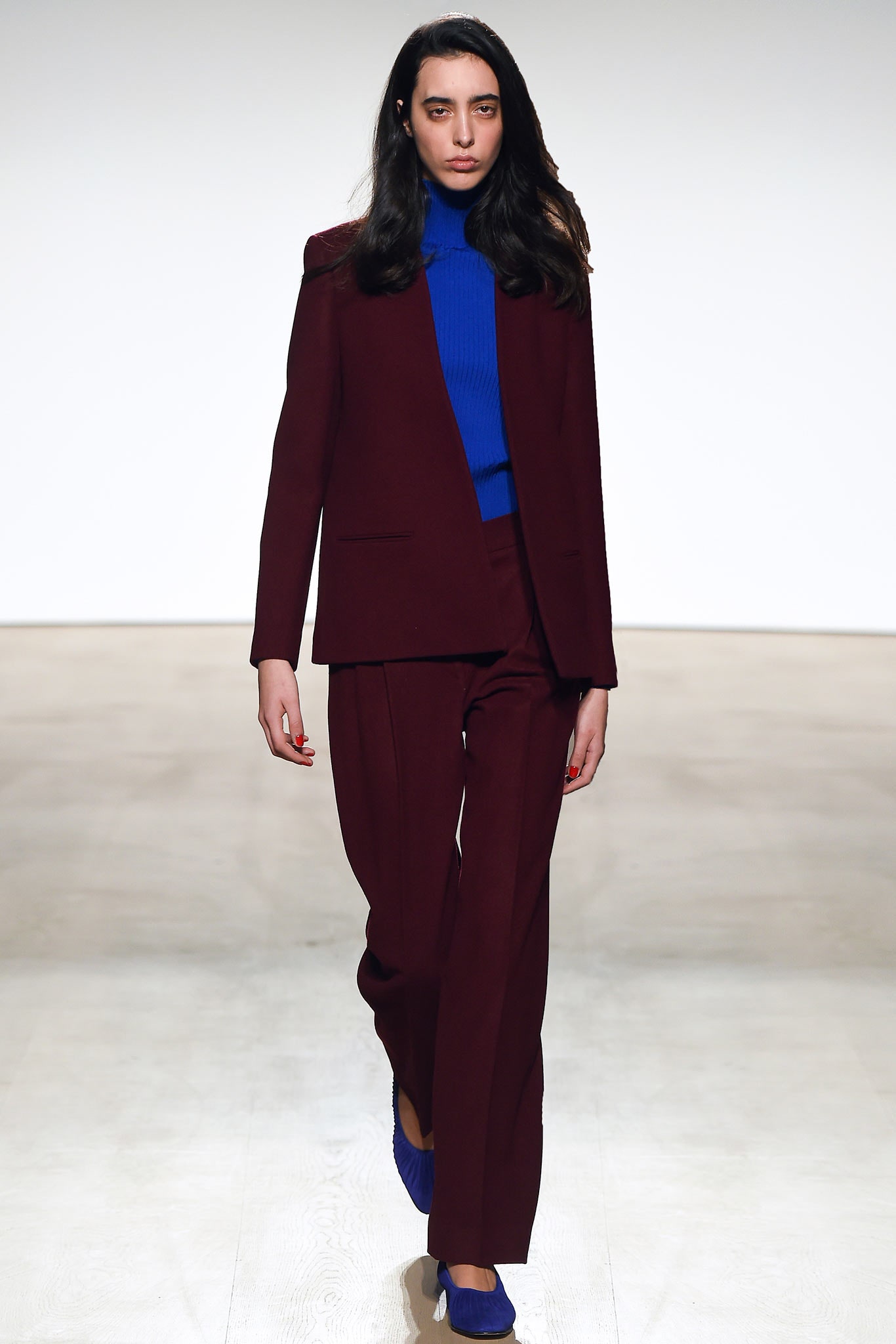 maroon suit with blue top