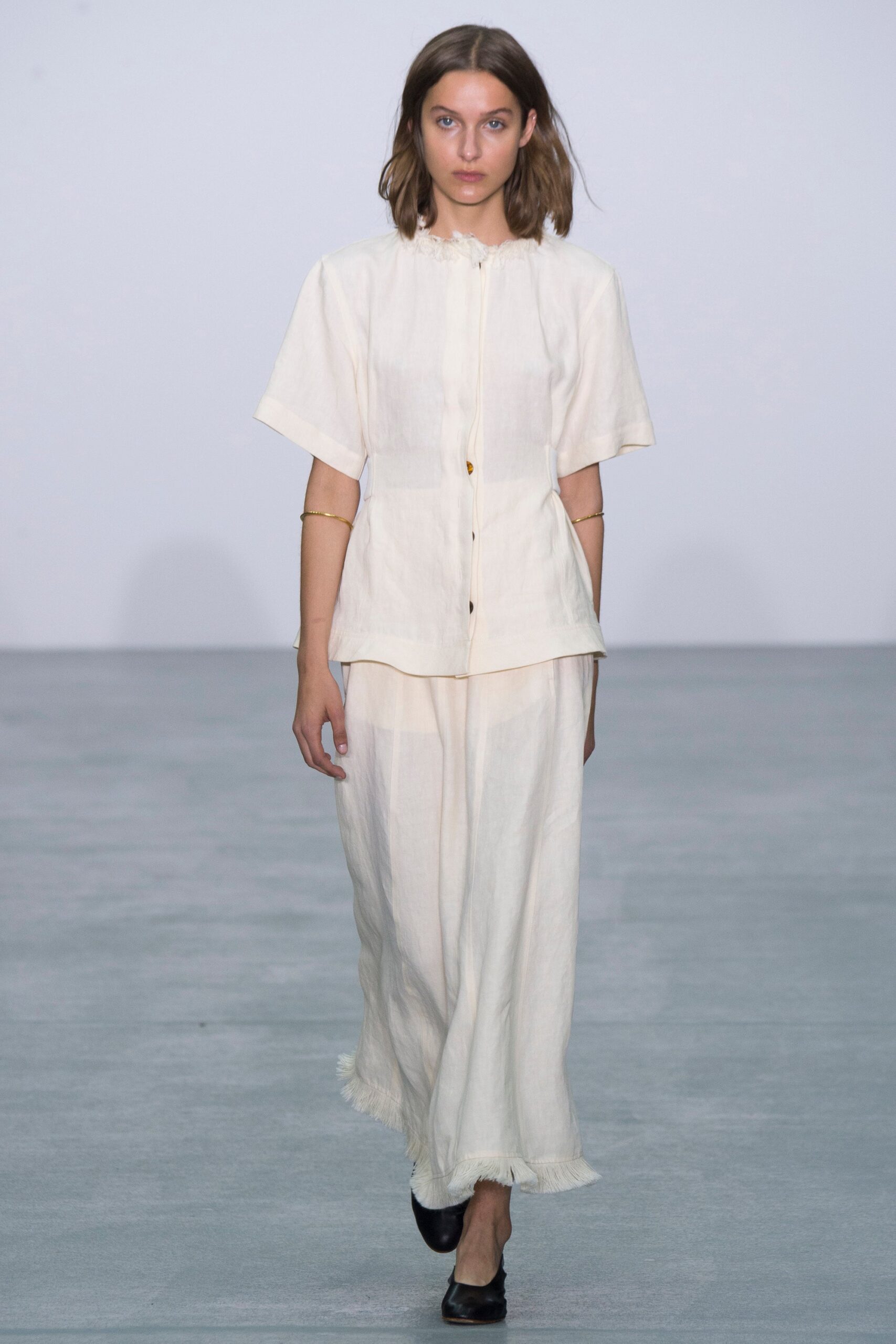 white linen short-sleeve collared relaxed buttoned blouse